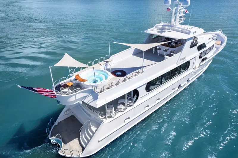 Aerial view of Envision's decks, sail shades, and yacht tub from above the stern
