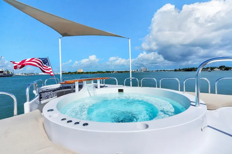 Envision's yacht tub on the flybridge beneath an American flag